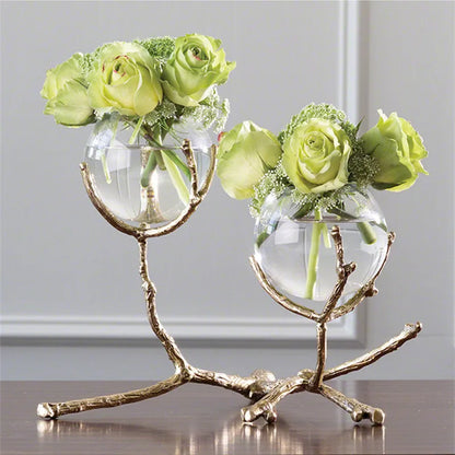 Glass vase with golden branches