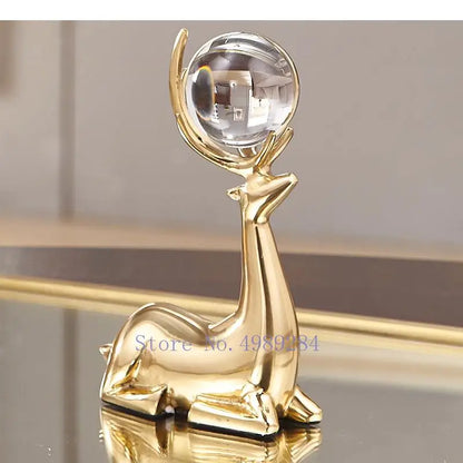 Gold deer ornaments set with a crystal ball