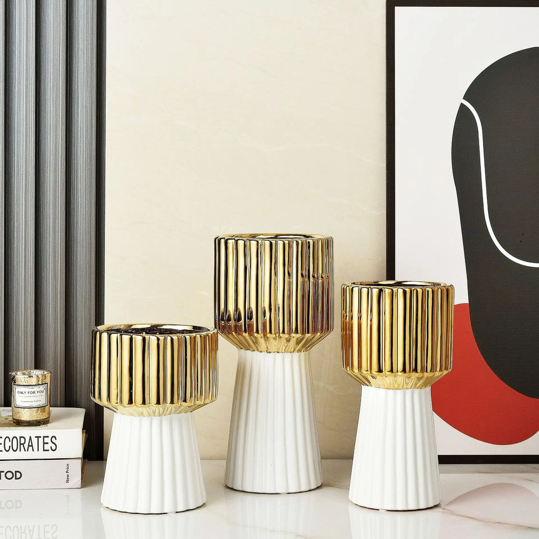 Modern ceramic vase in gold, white, and black colors.