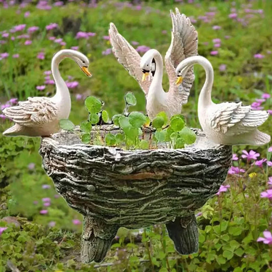 Resin flower pot with three white swans