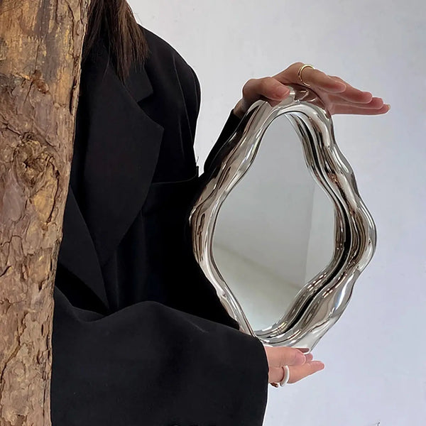 Vintage mirror with irregular high-color finish.