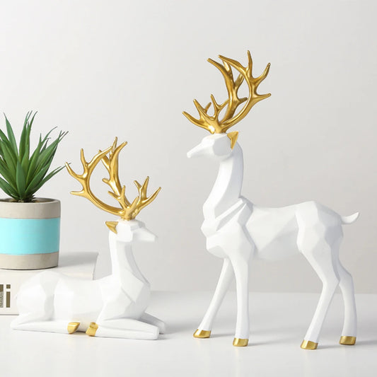 Two resin elk ornaments with origami design