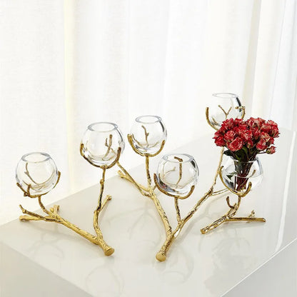 Glass vase with golden branches