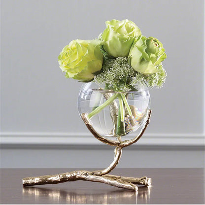 Glass vase with golden branches