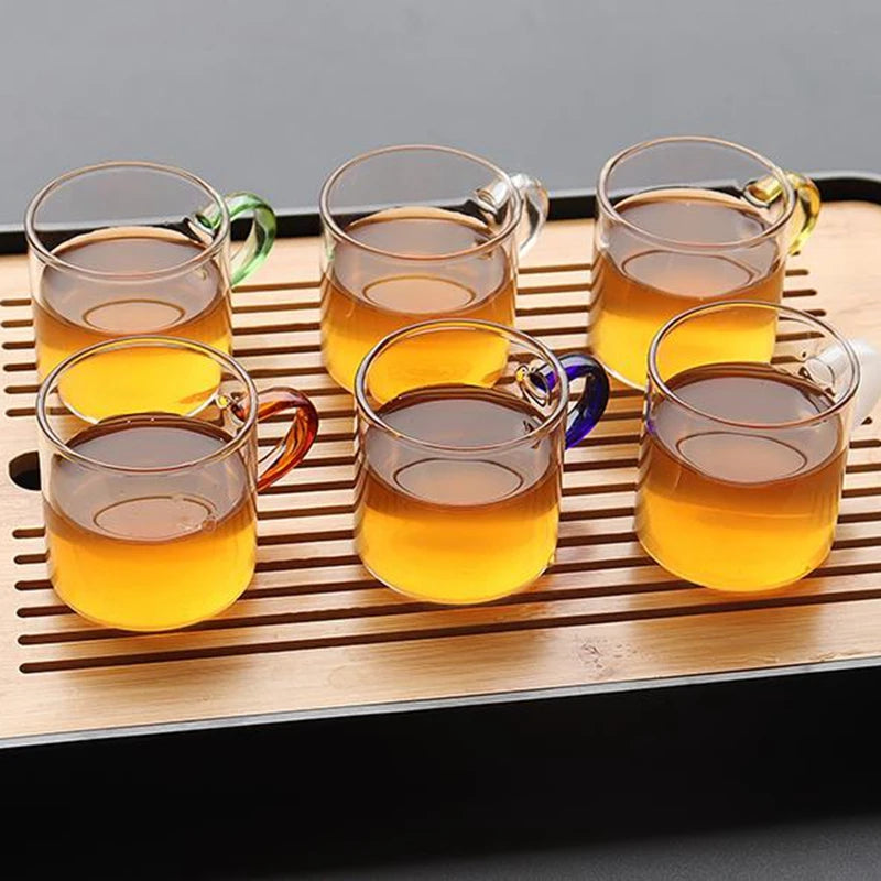 Transparent glass teacup with handle