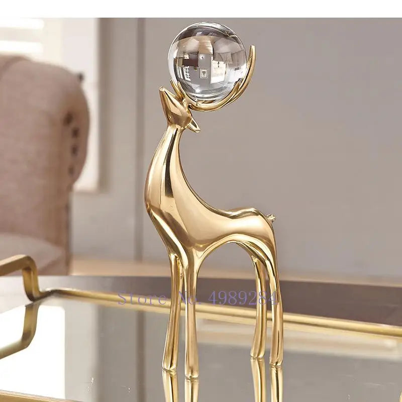 Gold deer ornaments set with a crystal ball